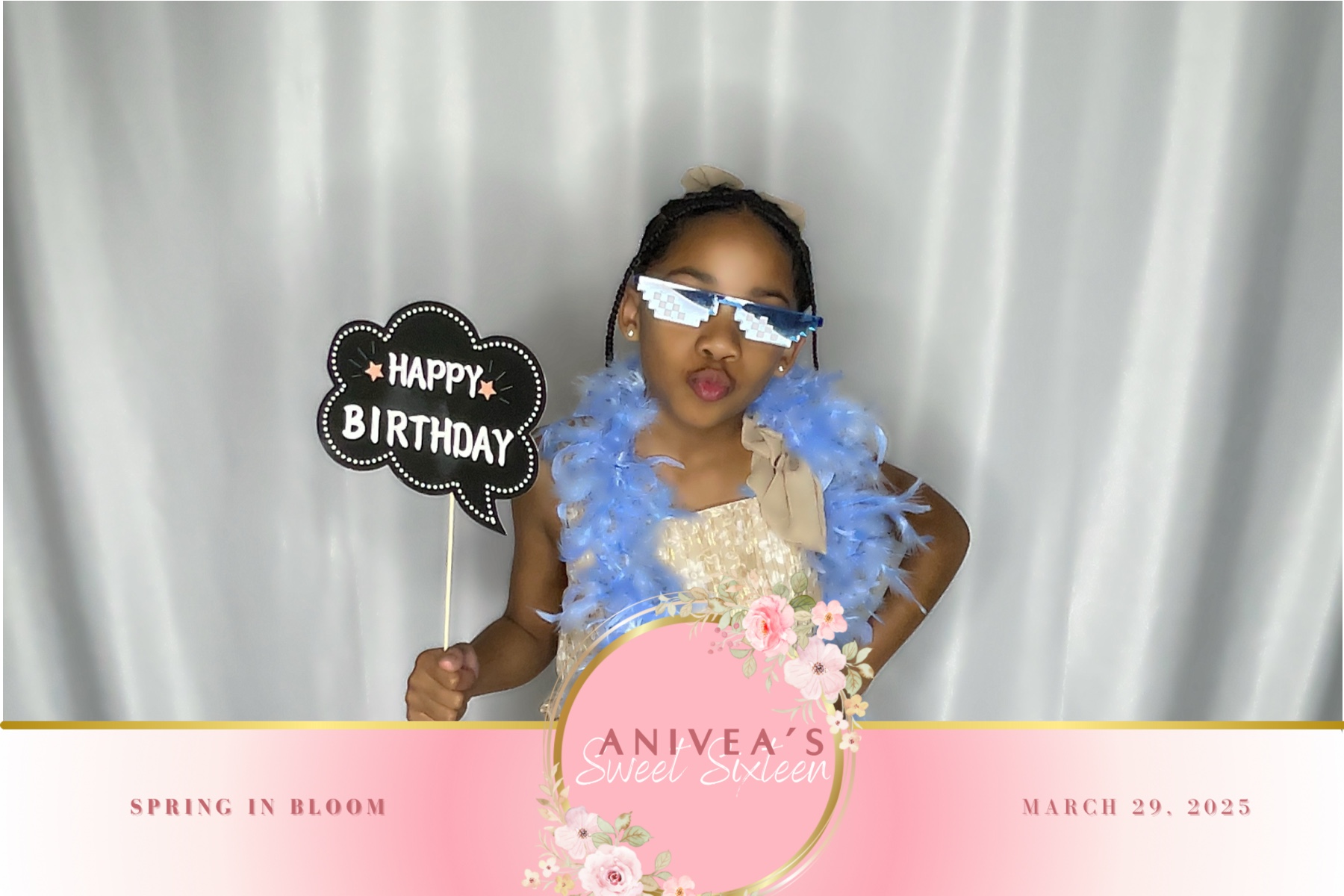 Young guest posing with birthday props in the photo booth